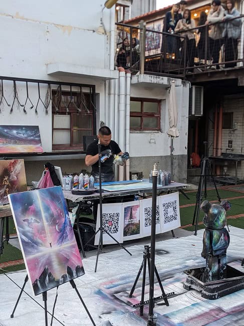 An artist working on spray paint art