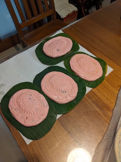 Red sticky rice cakes with red bean paste inside
