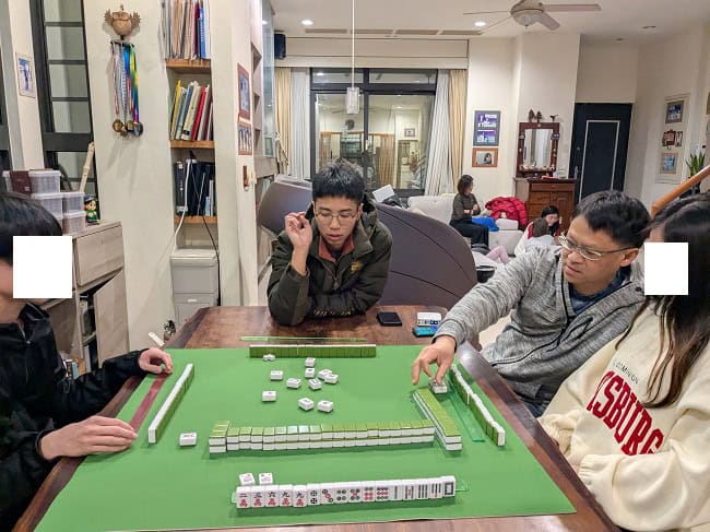 Playing mahjong with my cousin and nephews 
