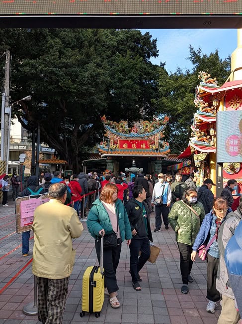 People visiting a temple to pray on the first day of the Lunar New Year
