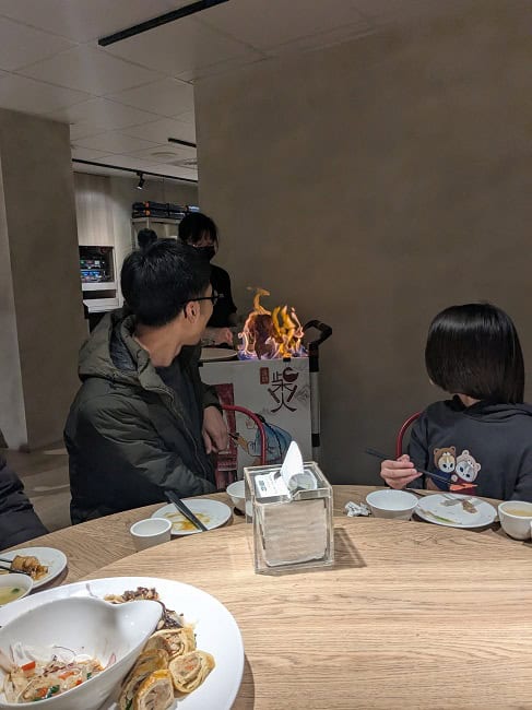 Lighting duck on fire to get crispy skins
